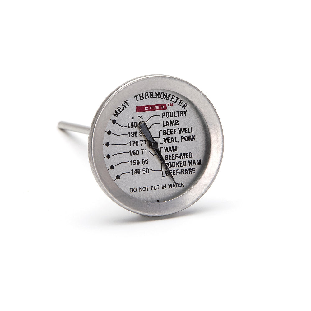 Metallic meat thermometer on a white background