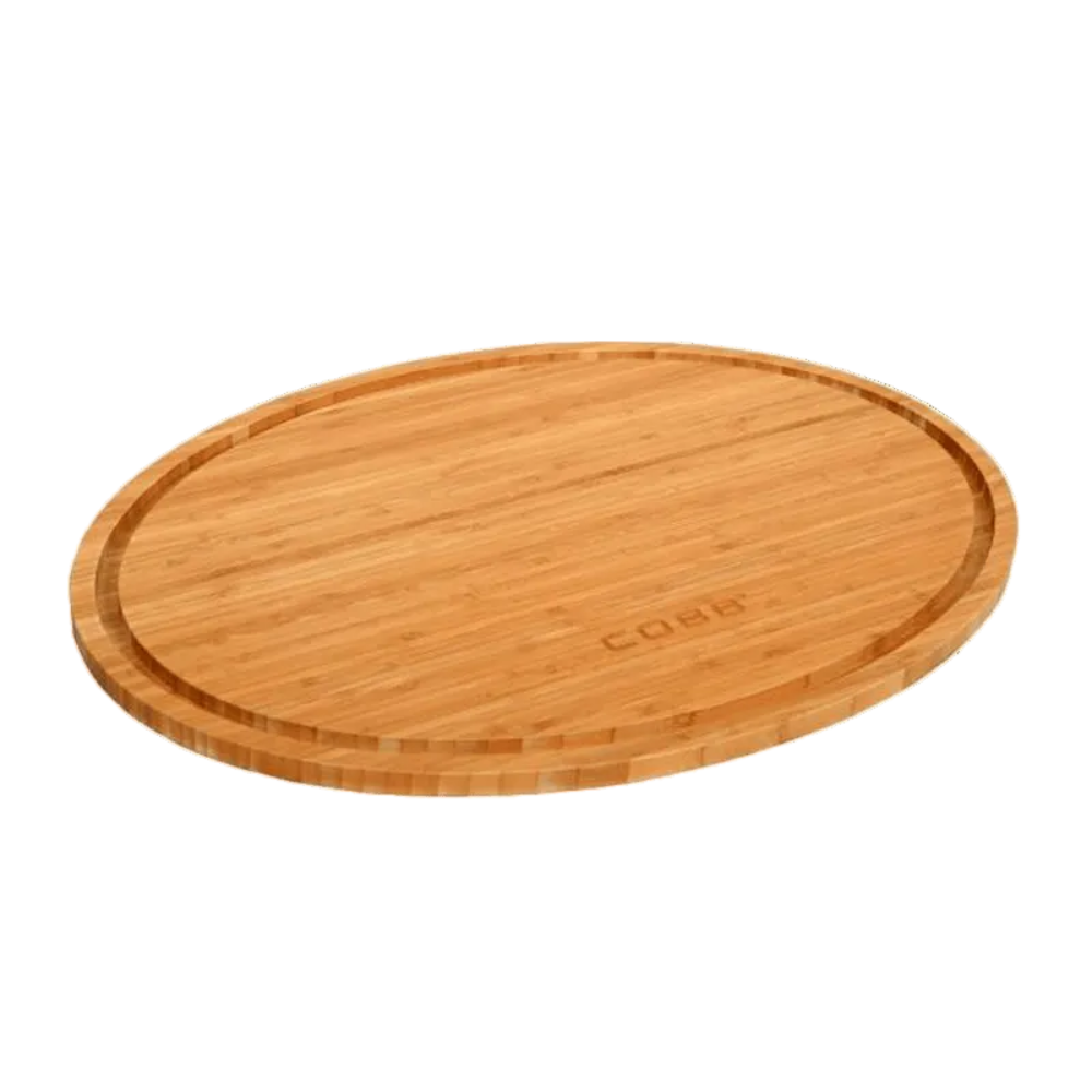 Wooden cutting board with 'COBB' branding on a white background