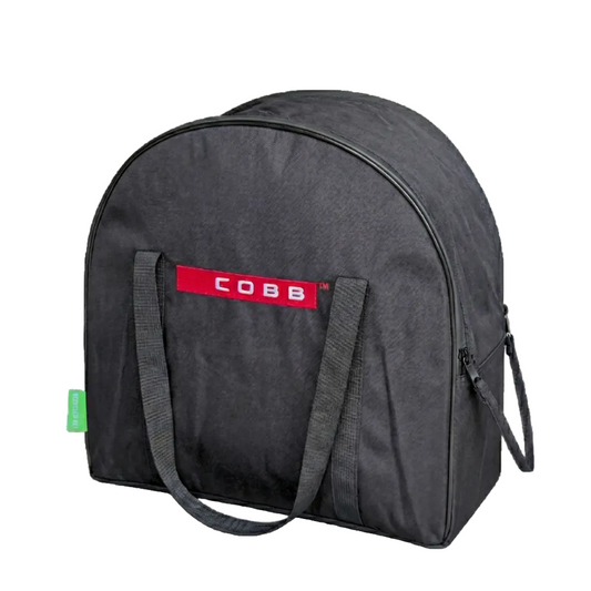 A black COBB brand accessory bag with a red logo patch on the front, dual carrying handles, and a side zipper, shown on a plain white background.
