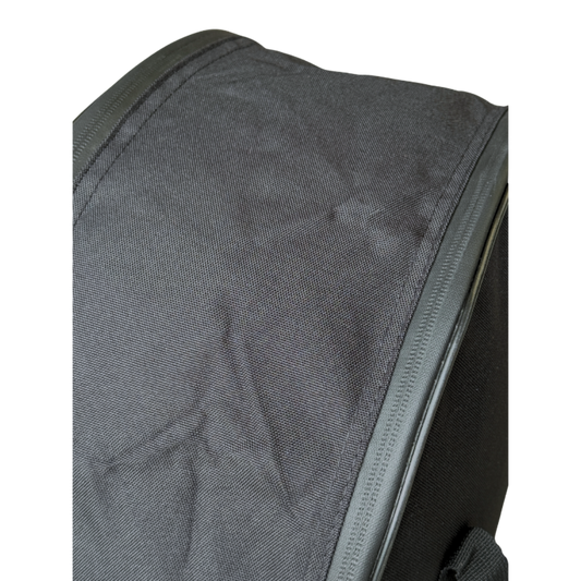 Close-up of a black fabric bag or backpack corner with a zipper, shown against a plain white background.