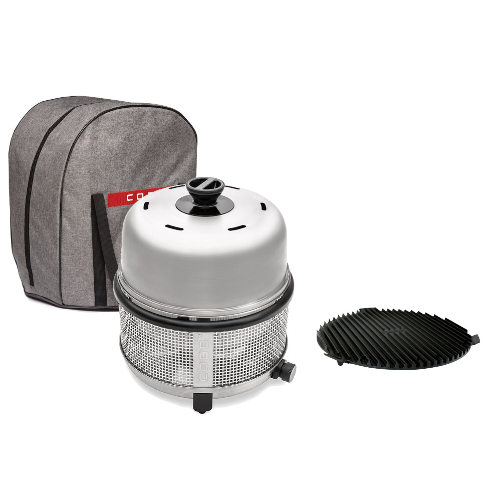 Portable grill set with gray carrying case, white grill body, and black grate on a white background.