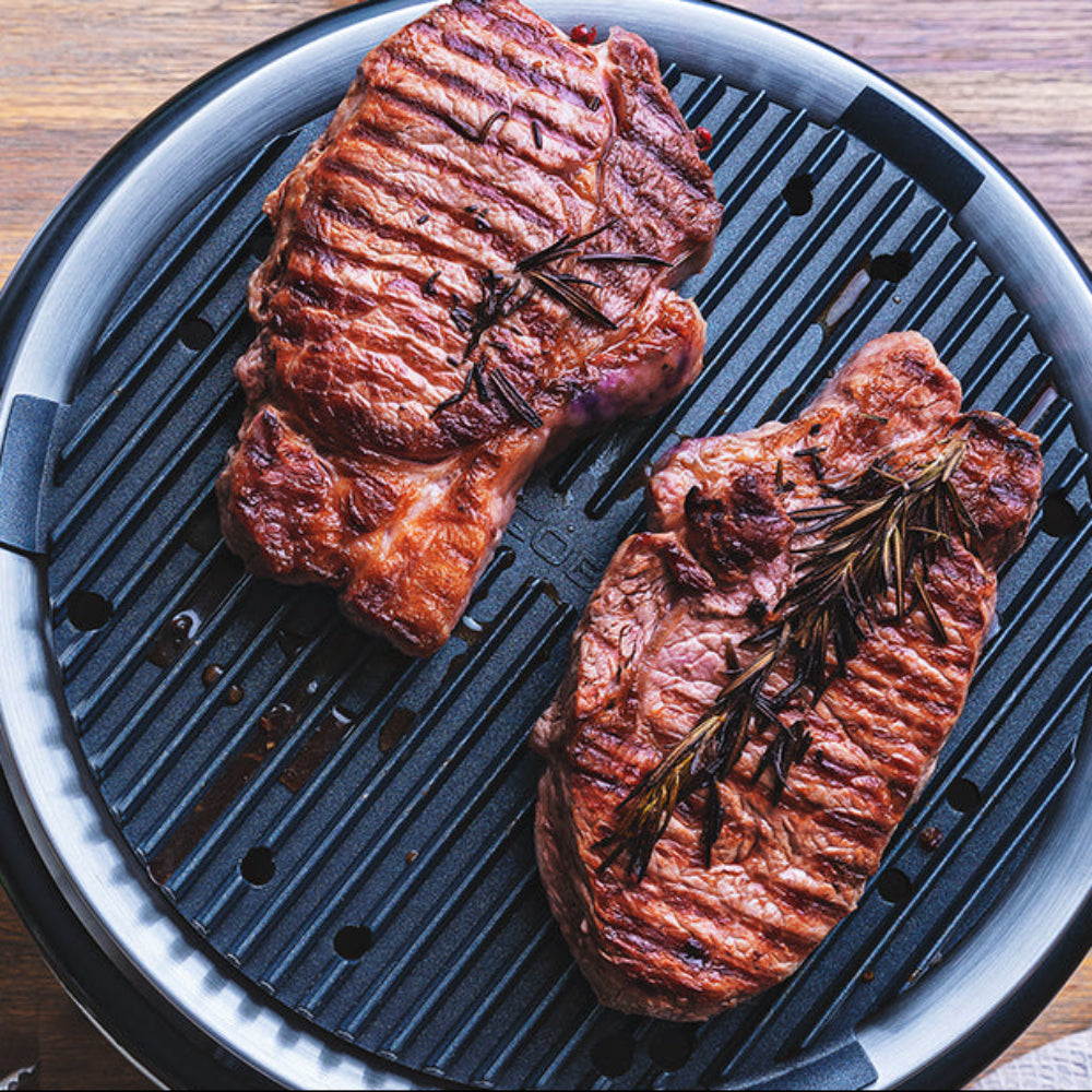 COBB Portable cooker with griddle and steaks
