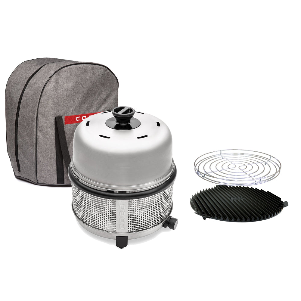 Portable grill set with gray carrying case, grill head, and accessories on a white background